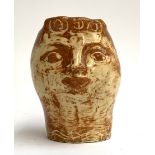 A studio pottery vase, attributed to Edward Eade (1911-1984), decorated with stylised face, 16cmH