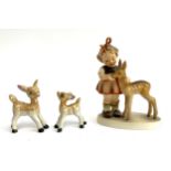 A Goebel figurine of a girl and deer fawn, 12.5cmH; together with two vintage Chinese deer fawn