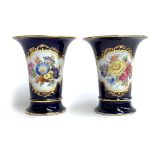 A pair of Meissen blue-ground trumpet vases, blue crossed swords marks, 13.5cm high