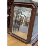 A mahogany framed wall mirror with canted corners and bevelled plate, 76x56cm