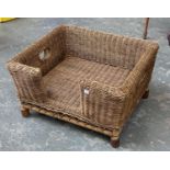 A small well made wicker dog basket, with open carry handles, 63x59x36cmH