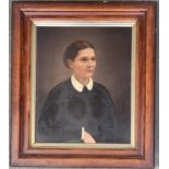 A 19th century American portrait of a lady in black, oil on board, inscribed to reverse 'Mrs John