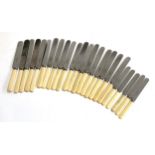 A good lot of bone handled and stainless steel table knives to include 5 by W Batty & Sons, the