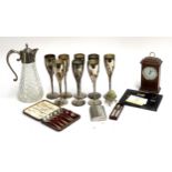 A mixed lot of include glass claret jug; eight metal wine goblets; quartz mantel clock; etc