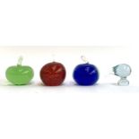 Four glass paperweights to include Liskeard Studio glass red apple paperweight, 9cmH, two other