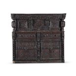 A Victorian carved oak court cupboard in Elizabethan taste 19th century raised on bun feet 163cm