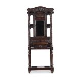 A carved oak hall stand in antiquarian taste late 19th or early 20th century 187cm high, 76cm