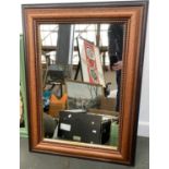 A stained pine wall mirror with bobble moulded inset, 78x59cm