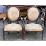 A pair of carved French open armchairs in Louis XV taste, 57cmW