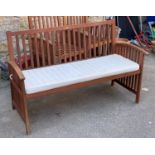 An Almar Garden teak garden bench, 134cmW, with cushion