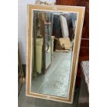 A gilt framed long mirror with bevelled plate, 136x70cm