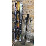 Three pairs of skis, Cross Xfight 400, Salomon Scream, and Head 500i liquid metal, together with 3