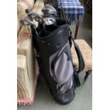 Five Slazenger golf clubs and a masters cub in a Slazenger golf bag