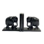 A pair of African carved hardwood elephant bookends, 17cmH