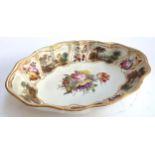 A Derby porcelain lozenge shaped serving dish painted with a central bouquet of flowers (John