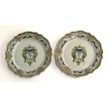 A pair of French faience armorial plates, each 23cmD