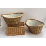 A pair of fabric lined wicker baskets, 58cmW and one other