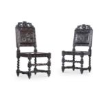 A pair of 17th century style carved oak side chairs late 19th or early 20th century the back of each