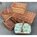 Five various wicker baskets, the largest 55cmW