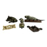 A quantity of brass castings to include wild boar sculpture, horse-head hanger, Arts & Crafts door