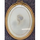 An Edwardian photograph of a lady, in oval gilt gesso frame, internal frame dimensions 21.5x16.5cm