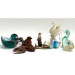 A quantity of animal figurines to include Border fine arts otter, art glass ducks and fish, carved