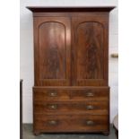 A 19th century mahogany linen press, pediment top over two doors, opening to reveal four slides, the