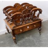 A Victorian mahogany three division canterbury, carved with shell cresting, over a single drawer, on
