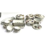 A quantity of Royal Worcester 'Evesham Vale' dinner wares to include tureens, serving dishes,