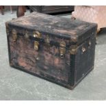 A large studded travel trunk, 87x52x58cmH; together with a canvas and woodbanded travel trunk, 91cmW