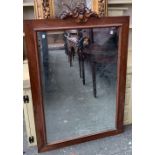 A mahogany framed rectangular wall mirror, with carved swag cresting, bevelled plate, 85x118cm