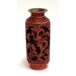 A Chinese Cinnabar style vase depicting dragons, 19.5cmH