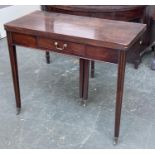 A George III mahogany tea table, foldover top, single frieze drawer, double gateleg action, on