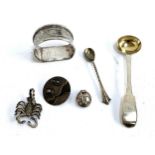 A William Eaton London 1832 condiment spoon with gilded bowl, an HM salt spoon, HM serviette