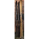 A pair of H S vintage wooden skis, together with another pair with bamboo poles