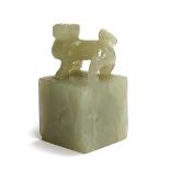 A Chinese carved jade foo dog seal of block form, 5cmH