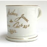 A 19th century porcelain Christening cup for Thomas Arthur Jones born Oct 24th, 1861, 9.5cmH