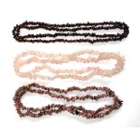 A garnet chip necklace, 44cmL; rose quartz chip necklace, 45cmL; and one other