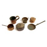 A lot of miniature copper items to include a half gill measure, miniature frying pan, colander etc
