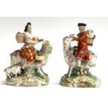A pair of 19th century Staffordshire figurines of a couple riding goats (both af), each incised to