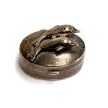 A Garrard & Co silver pill box, the lid with two leaping dolphins, 3cmD, approx. 10.9g