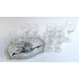 A quantity of knopped stem glasses, together with a glass tray depicting heron in flight