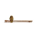 A 9ct gold bar brooch in the form of an owl on a branch, approx. 2.3g