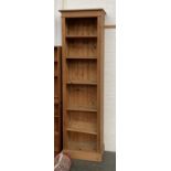 A tall narrow pine bookshelf, five adjustable shelves, 66x36x223cmH