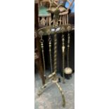 A set of brass fire tools, on a barley twist brass stand with double headed eagle cresting, 100cmH