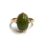 A 9ct gold ring set with a Connemara marble cabochon, 3.7g, size K