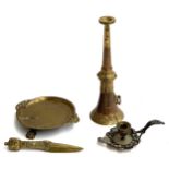A brass ceremonial dagger, the hilt with a three faced terminal, a cloisonne enamel candlestick,