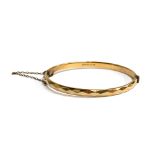A Georg Jensen 1/5 9ct rolled gold bangle, with safety chain, approx. 15.2g, 7cmD