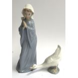 An NAO figure of a praying girl, 27cmH; together with an NAO figure of a duck, 11cmH