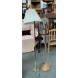 A gilt metal standard lamp, with shade, together with a mid century turned wood standard lamp